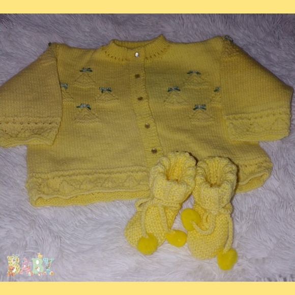 yellow knitted baby outfit